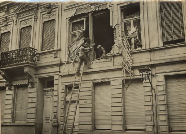 Reconstructing destroyed buildings in Merxen near Antwerp.