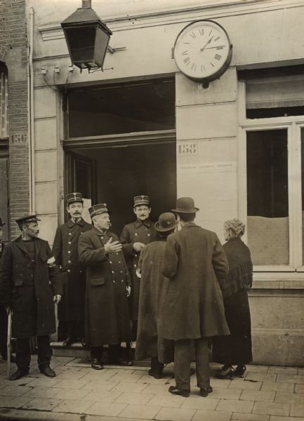 Antwerp police in front of a guard house.