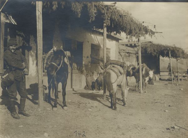 Troops resting in front of an inn in the Taurus Mountains. 