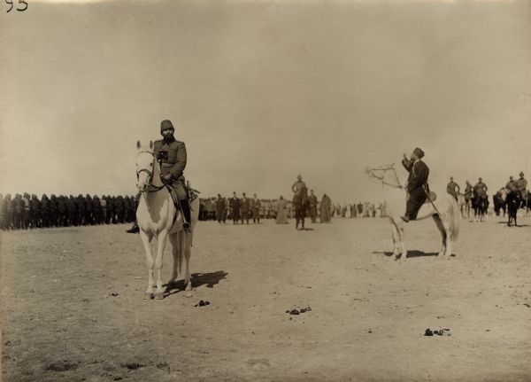 Djemal Pascha on horseback with a Muslim cleric, known as the Hodscha, giving a blessing to troops departing for the Suez Canal. 