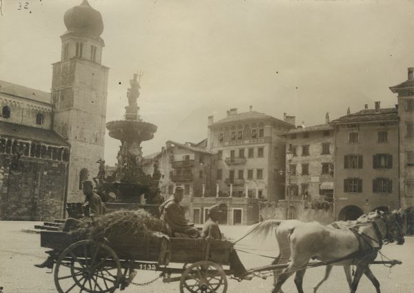 Wagons and horse-drawn vehicles passing through Trient carrying supplies to soldiers. 