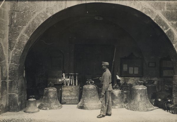 Church and city bells of Trient, with a soldier inspecting them. 