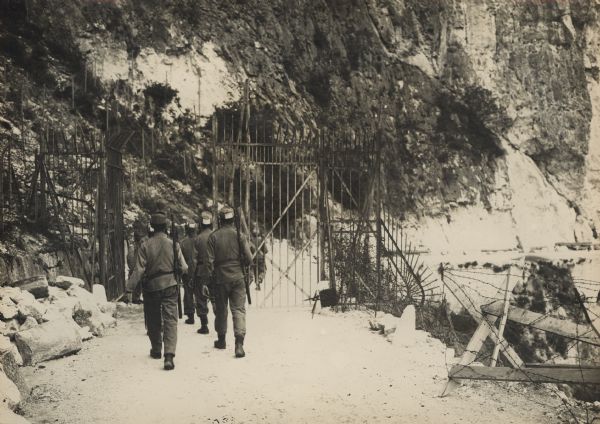 Tiroler Landesschuetzen (territorial troops from the Province of Tyrol)  passing through a barricade in the mountains in preparation for a nighttime patrol. 