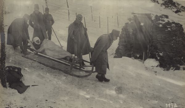 Transporting an injured soldier in the high mountains of Tirol. 