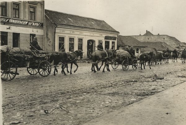 Street scene in Sabac, with a passing Austrian column of wagons. 