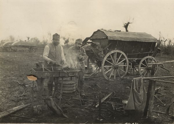 The bad roads in Serbia are damaging to wagons and wheels. As a result one finds temporary field smithy's set up everywhere in Serbia. 