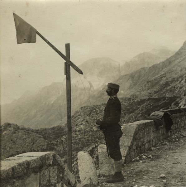 Flag signal station on a mountain road at Lovcen. Raising the flag signals wagons below to stop. 