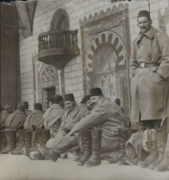 Through Bosnia and the Herzegovina during the war. Celebrating the Mevlud (Mawlid) festival to commemorate Mohammed's birthday on January 18th (1916) in Sarajevo. Bosnian Muslim soldiers on the temple floor at the Begova (Gazi Husrev-bey) Mosque in Sarajevo.