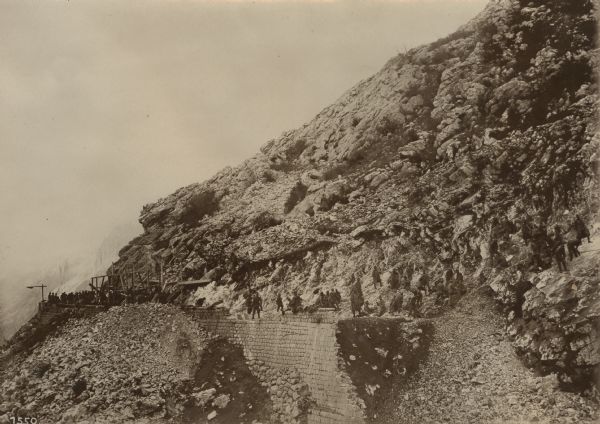 Repair work on a stone viaduct on a serpentine road on Mount Lovcen that had been damaged by the Montenegrins.  