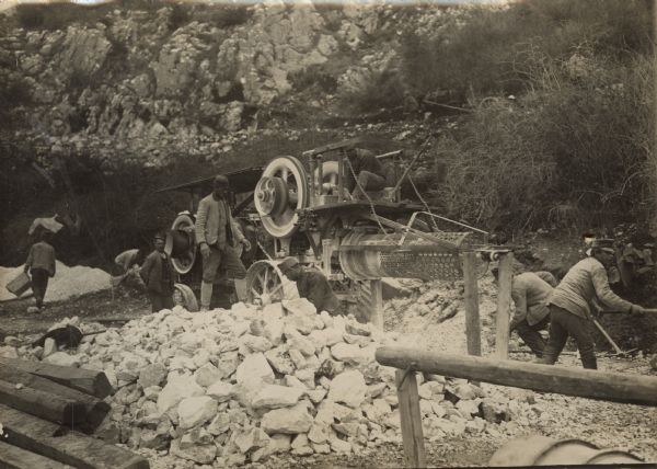 Repair work on Mount Lovcen to repair roads. Austrian troops using a rock crusher.