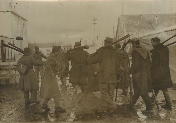 Montenegrin soldiers surrendering their weapons.