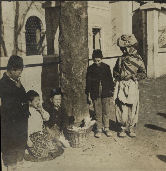 Children selling treats in front of the mosque in Sarajevo, Bosnia. 