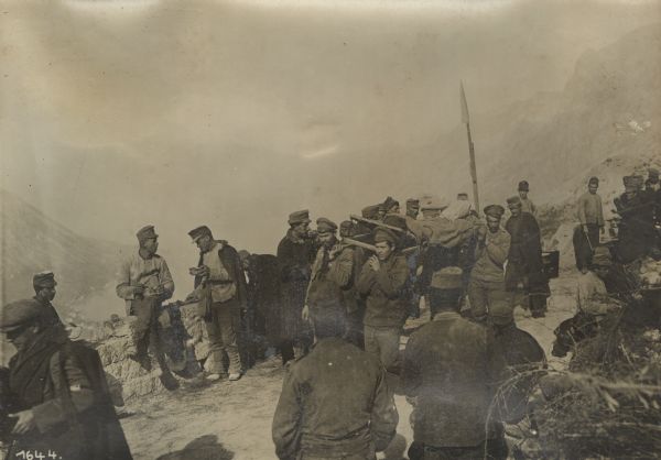 Russian POW's carrying wounded Austrian soldiers over difficult terrain in the Black Mountains, Montenegro and Albania. The Black Mountain(s) refers to the area around Mount Lovcen in Montenegro. 