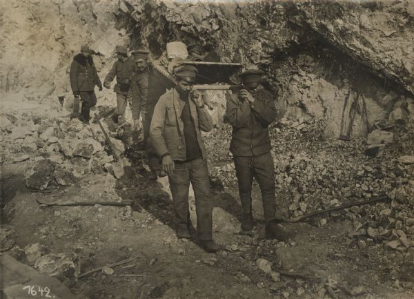 Russian POW's carrying wounded soldiers over difficult terrain in the Black Mountains of Montenegro. The Black Mountain(s) refers to the area around Mount Lovcen in Montenegro