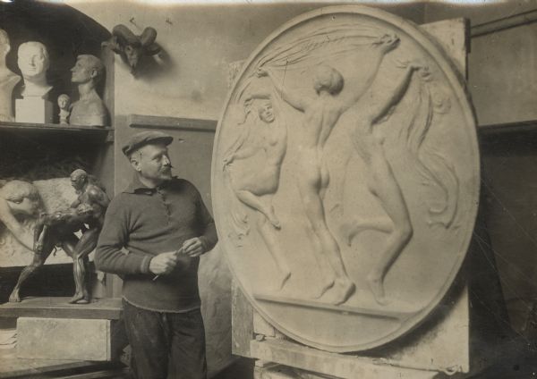 The pursuit of art in wartime. Professor B. Friedrich with his relief "Allegory of Dance."