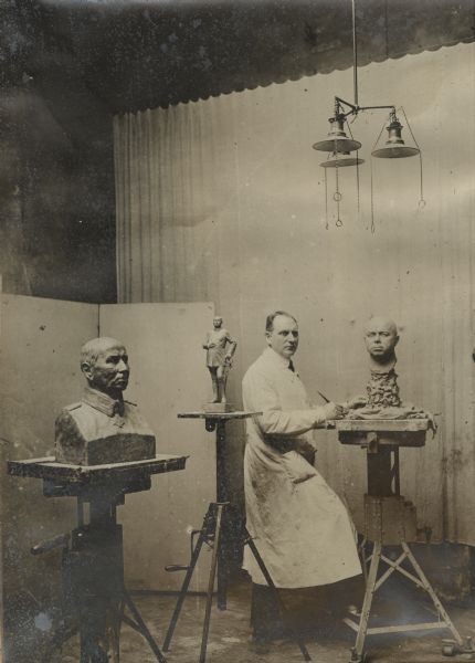 The pursuit of art in wartime. Professor August Kraus (1868-1934) modeling a bust of General von Kluck, Berlin.