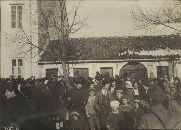 Distribution of bread by our soldiers to the needy Montenegrin residents of Cetinje, Montenegro. Cetinje was the old royal capitol of Montenegro. 