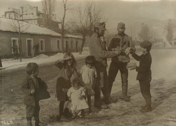 Montenegrin children selling devalued paper money to our soldiers.