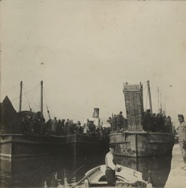 Serbian prisoners being loaded onto ships in the bay, Montenegro and Albania. 
