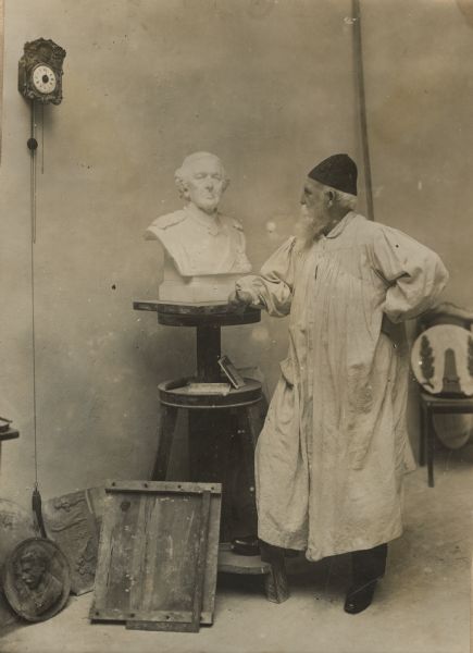 The pursuit of art during wartime. Professor Richard Anders modelling a bust of General von Haeseler, Berlin. 