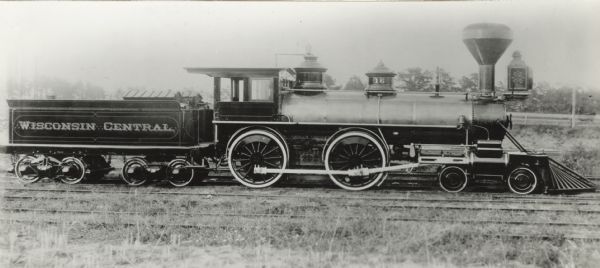 Right side profile view of the Wisconsin Central Railroad Locomotive No. 16, built by the Schenectady Locomotive Works in 1882, and scrapped in 1910.<p>Specifications: construction no. 1598, 4-4-0. cylinders 18 inch x 24 inch, drivers 62 inches, weight without tender 78,400 lbs. The cylinders were reduced to 17 inches diameter about 1890.