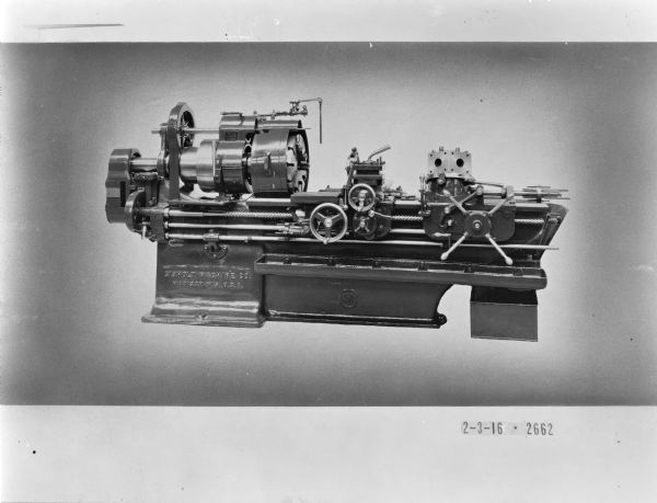 Hand-operated Gisholt saddle lathe with 3 1/2 " spindle bore. The dimensions of these 21" lathes was 10'3" long and 3'3" wide, bearing the approximate net weight of 6000 pounds.