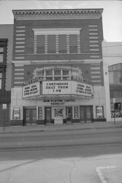 View across King Street towards the Majestic Theater. The marquee has signs that read: "George Segal, Glenda Jackson, 'A Touch of Class' and 'Continuous Daily From 1 PM.' A sign above the ticket booth reads: "Now Playing Capitol 'Exorcist'."