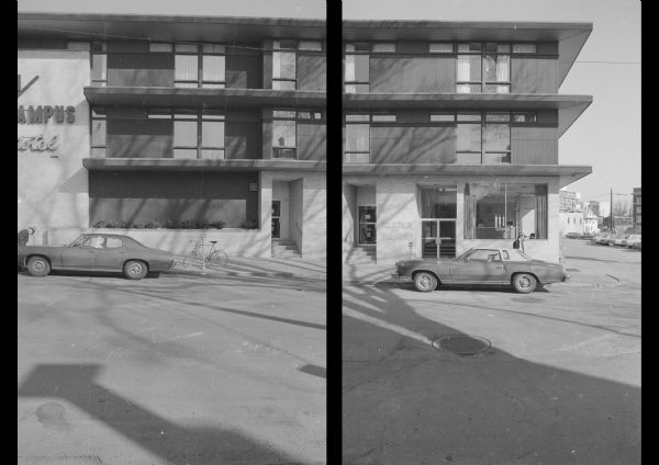 View across North Frances Street towards the Town/Campus Motel, which is at the corner of State Street (out of view on the left). Cars and bicycles are parked along the curb in front, and a parking lot is along the right side of the hotel. Faded graffiti near the main door reads: "Disaster = Vietnam."