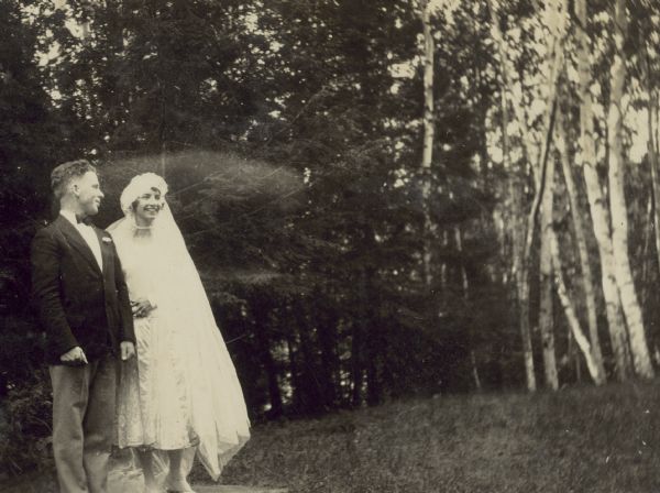 Outdoor wedding portrait of Eleanor Holt and Donald DeWitt. The ceremony was held at the Island on Archibald Lake.