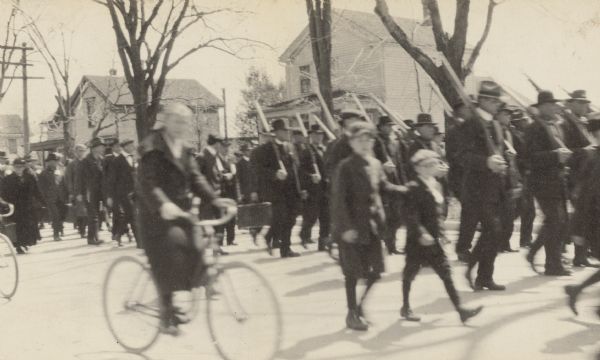 View of a parade. Caption reads: "Drafted men."