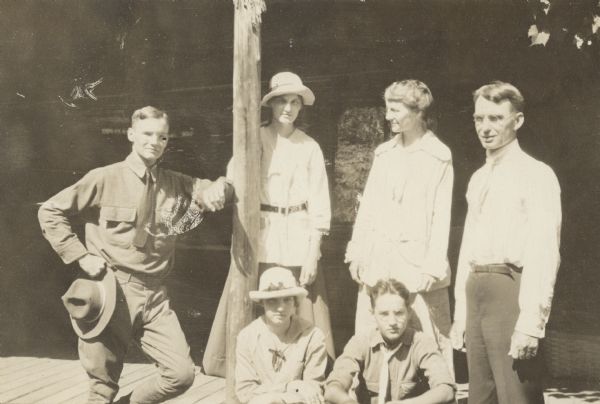 A casual portrait of the Lucy and W.A. Holt family. Standing from left to right: Alfred Holt in military uniform, Jeannette Holt, Lucy Rumsey Holt, W.A. Holt. Sitting from left to right: Eleanor Holt and Donald Holt. Caption reads: "W.A. Holt Family."