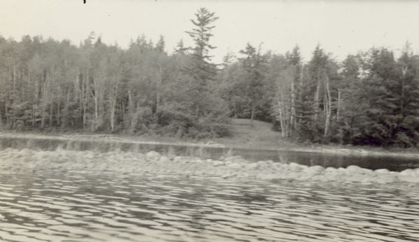 View of a stone reef on Archibald Lake. Caption reads: "Apple Tree Landing Showing Stone Reef."