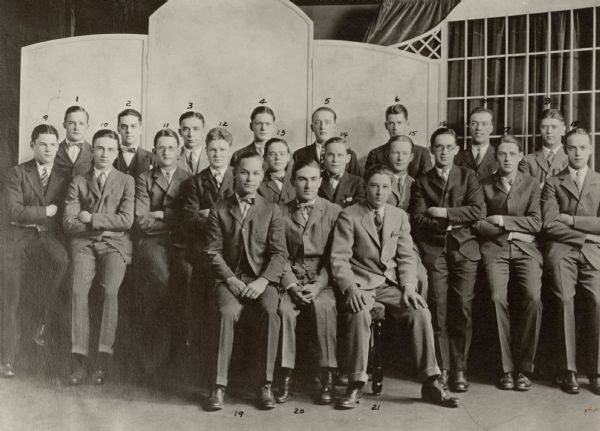 A copy photograph of an image made in May, 1924, of the Iota chapter of Mu Delta Sigma at the Milwaukee University School comprising 21 young men. Those identified in a letter accompanying the photograph include Charles A. Krause, no. 4; Edward J. Brumder, no. 6; and Joseph B. Gutenkunst, no. 18. Brumder was 17 years old at the time of the photograph.