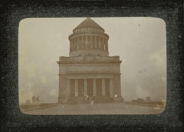 Two women posing on the steps of Grant's Tomb.