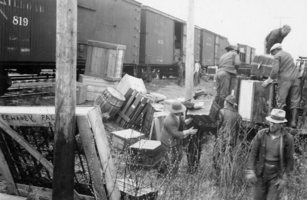 One of two images under the headline: "Colonists Play 'Find the Freight'; a Beauty Shop." Original caption reads: "Freight is tossed off  anywhere along the railroad right of way at Palmer, Alaska, but the colonists manage to locate their property somehow."
