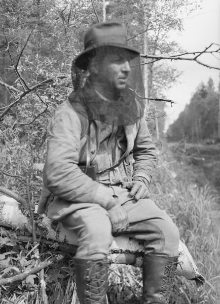 One of two images under the headline: "Journal Writer in Alaska; Pioneer Woman Raises Firs." Original caption reads: "Arville Schaleben, Journal staff writer with the colonists, wearing his head net and heavy gloves to ward off the mosquitoes."