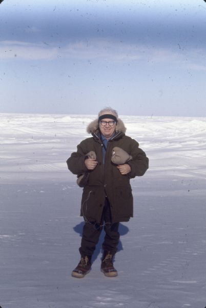 <i>Milwaukee Journal </i> reporter and editor Arville Schaleben standing outdoors at Arco-Humble, Prudhoe Bay Field.