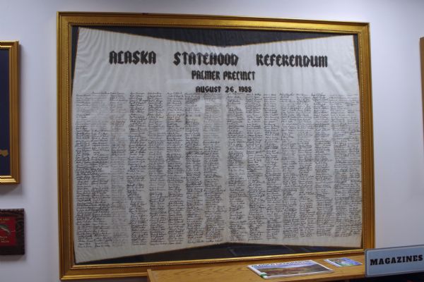 Framed referendum signed by citizens of Palmer, Alaska. The referendum was passed in 1958. The document is on display in the local history room of the Palmer Public Library. 