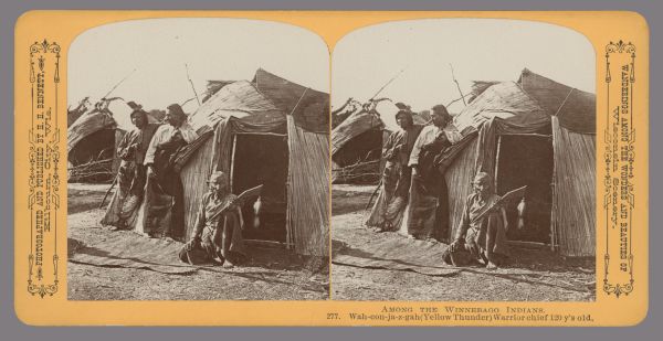 Wah-con-ja-z-gah (Yellow Thunder), a 120-year-old Winnebago warrior chief, posing in front of a typical dwelling (chipoteke), with two men leaning against the wall behind him. Caption at bottom: "Among the Winnebago Indians. 277. Wah-con-ja-z-gah (Yellow Thunder) Warrior chief 120 y's old." Text at right: "Wanderings Among the Wonders and Beauties of Wisconsin Scenery."