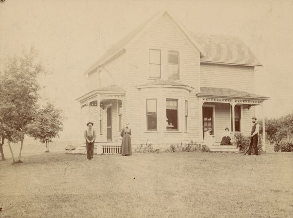 Caption reads: "Home of Benjamin Aurey Wood (mother's oldest brother) near Baraboo, Wis. c. 1901. L. to R.: B.A. Wood, his wife the former Sarah Van Pelt, May Wood-Simons, unknown, A.M. Simons."