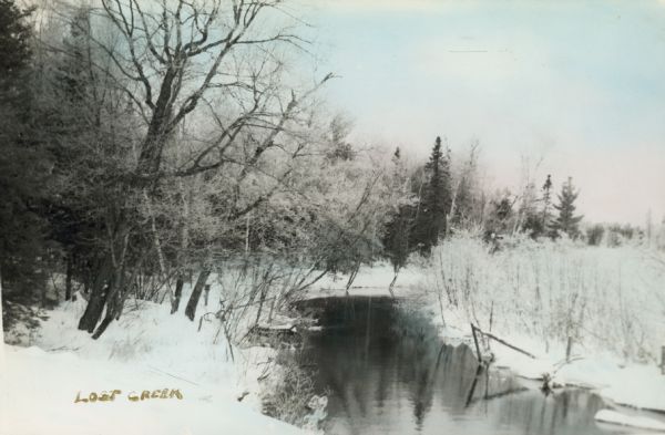 Hand-colored view of Lost Creek. Snow is on the ground.