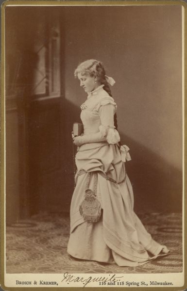 Carte-de-visite portrait of Lina Martin, in costume as Marguerite from Johann Wolfgang von Goethe's play <i>Faust</i>.