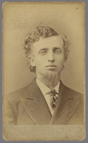 Carte-de-visite portrait of Bradford W. Gillett, who was a teacher, shopkeeper, and principal of schools in Middleton, Belleville, and Avoca. He was active in county politics in Iowa county and then owned a general store in Avoca. Image caption reads: "Bradford W. Gillett, U.W. Cl. of 76."