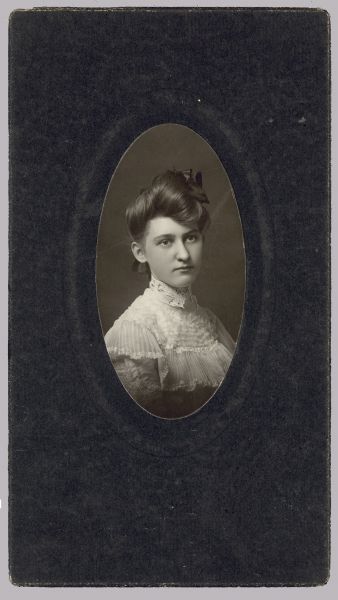 Oval-framed quarter-length portrait of Hannah Aalberg, a nurse.