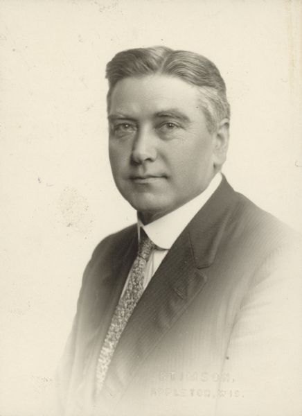 Vignetted waist-up portrait of Dr. Henry William Abraham, a German immigrant, physician, and president of the Fox River Valley Medical Society.