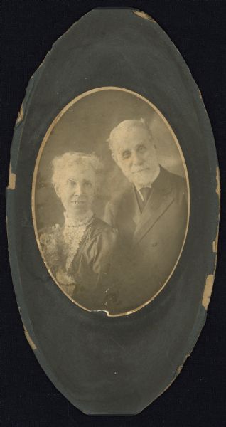 Oval-framed portrait of a couple. E. W. Adams was Secretary of the Chicago, Milwaukee & St. Paul Railway Company.