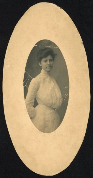 Oval-framed three-quarter length portrait of Blanche Adams Willison, daughter of E. W. Adams.