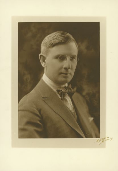 Quarter-length studio portrait of Harry Wilfred Adams, a lawyer and mayor of Beloit, 1914-1918.