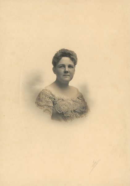 Vignetted waist-up portrait of Mary Matthews Adams, wife of Charles Kendall Adams, 1890-1902. She was a philanthropist and poet, whose published works included <i>Epithalamium</i> (N. Y. and London, 1889); <i>The Choir Visible</i> (Chicago, 1897); and <i>Sonnets and Songs</i> (N. Y. and London, 1901).