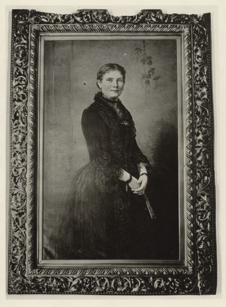 Photograph of a framed painting of Mary Mathews Adams, wife of Charles Kendall Adams, 1890-1902. She was a philanthropist and poet, whose published works included <i>Epithalamium</i> (N. Y. and London, 1889); <i>The Choir Visible</i> (Chicago, 1897); and <i>Sonnets and Songs</i> (N. Y. and London, 1901).